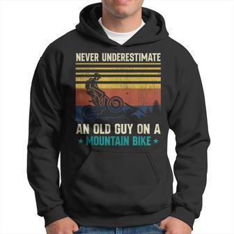 Never Underestimate An Old Guy On A Mountain Bike Mtb Hoodie - Seseable