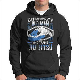 Never Underestimate An Old Man Jiu Jitsu Martial Arts Gift Old Man Funny Gifts Hoodie | Mazezy