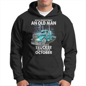 Never Underestimate An Old Man Who Is A Trucker Born October Hoodie - Seseable