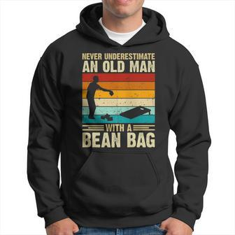 Never Underestimate An Old Man With A Bean Bag Cornhole Hoodie - Seseable
