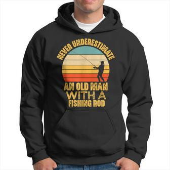 Never Underestimate An Old Man With A Fishing Rod Funny Gift Old Man Funny Gifts Hoodie | Mazezy UK