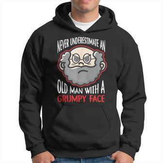 Never Underestimate An Old Man With A Grumpy Face Grandpa Hoodie | Mazezy