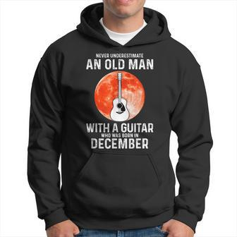 Never Underestimate An Old Man With A Guitar December Hoodie - Seseable