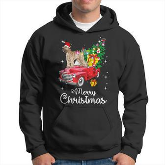 Soft Coated Wheaten Terrier Rides Red Truck Christmas Hoodie | Mazezy