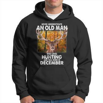 Never Underestimate A Man Loves Hunting Born In December Hoodie - Seseable
