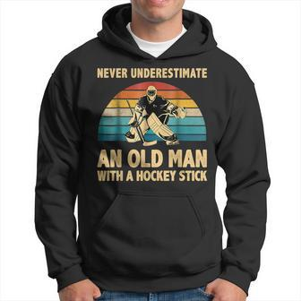 Never Underestimate An Old Man With A Hockey Stick Vintage Hoodie | Mazezy
