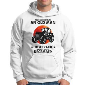 Never Underestimate An Old Man With A Tractor Born December Hoodie - Seseable