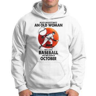 Never Underestimate An Old Woman Love Baseball October Old Woman Funny Gifts Hoodie | Mazezy