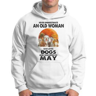 Never Underestimate An Old Woman Who Loves Dogs Born In May Hoodie - Seseable