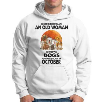 Never Underestimate An Old Woman Who Loves Dogs Born October Old Woman Funny Gifts Hoodie | Mazezy
