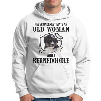 Never Underestimate An Old Woman With A Bernedoodle Old Woman Funny Gifts Hoodie | Mazezy