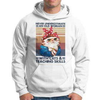 Never Underestimate An Old Woman With Cats And Teaching Old Woman Funny Gifts Hoodie | Mazezy