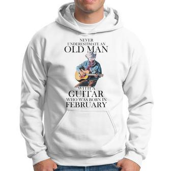 Never Underestimate A February Man With A Guitar Hoodie | Mazezy