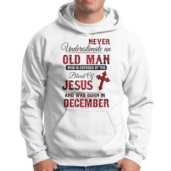 Never Underestimate An Old Man Blood Of Jesus December Hoodie - Thegiftio UK