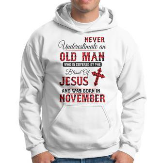 Never Underestimate An Old Man Blood Of Jesus November Hoodie - Thegiftio UK