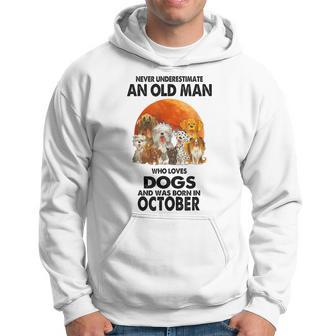 Never Underestimate An Old Man Who Loves Dogs Born October Hoodie | Mazezy