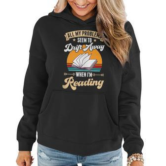 All My Problems Seem To Drift Away When Im Reading Reading Funny Designs Funny Gifts Women Hoodie | Mazezy