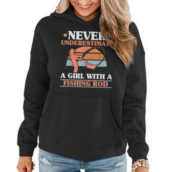 Never Underestimate A Girl With A Fishing Rod Women Angling Fishing Rod Funny Gifts Women Hoodie | Mazezy