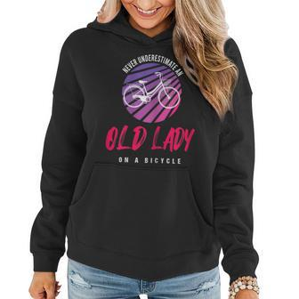 Never Underestimate An Old Lady On A Bicycle Gift For Womens Women Hoodie - Seseable