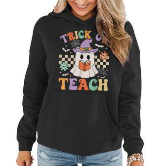 Trick Or Teach Groovy Teacher Halloween Retro Floral Ghost Women Hoodie - Seseable