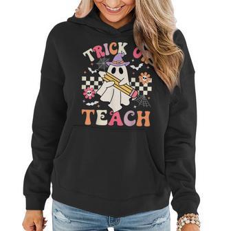 Trick Or Teach Groovy Teacher Halloween Retro Floral Ghost Women Hoodie - Seseable