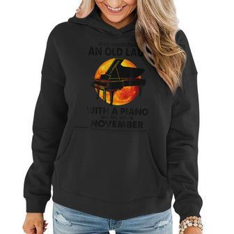 Never Underestimate An Old Lady With A Piano Born November Women Hoodie - Thegiftio UK
