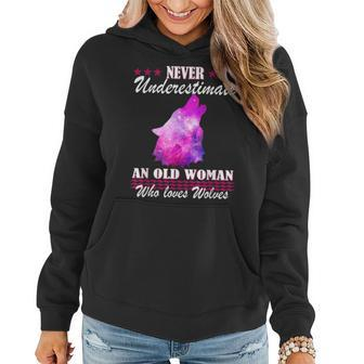 Never Underestimate An Old Woman Who Loves Wolves Women Hoodie - Thegiftio UK