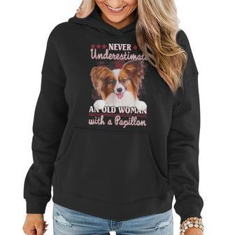Never Underestimate An Old Woman With A Papillon Women Hoodie | Mazezy
