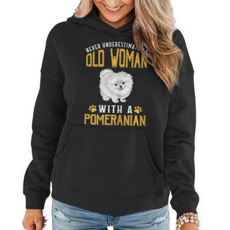 Never Underestimate An Old Woman With A Pomeranian Cute Women Hoodie - Thegiftio UK