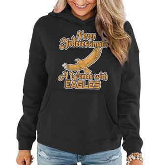 Never Underestimate A Woman With Eagles Bald Eagle Women Hoodie - Thegiftio UK