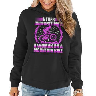 Never Underestimate A Woman On A Mountain Bike Women Hoodie - Monsterry