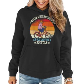 Vintage Never Underestimate An Old Lady On A Bicycle Retro Women Hoodie | Mazezy