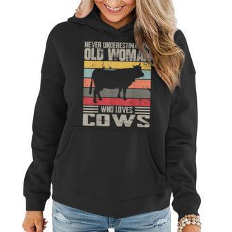 Vintage Never Underestimate An Old Woman Who Loves Cows Cute Women Hoodie - Seseable