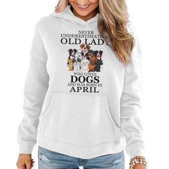 Never Underestimate An Old Lady Who Loves Dogs April Women Hoodie - Seseable