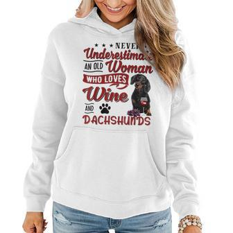 Never Underestimate An Old Woman Who Loves Wine & Dachshund Women Hoodie - Seseable