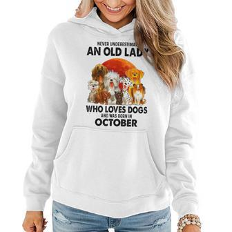 Never Underestimate An Old Lady Who Loves Dogs October Women Hoodie | Mazezy