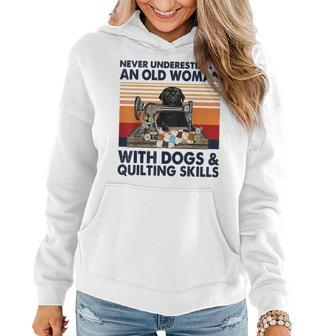 Never Underestimate An Old Woman With Dogs & Quilting Skills Women Hoodie | Mazezy
