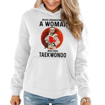 Never Underestimate A Woman Who Loves Taekwondo Women Hoodie | Mazezy
