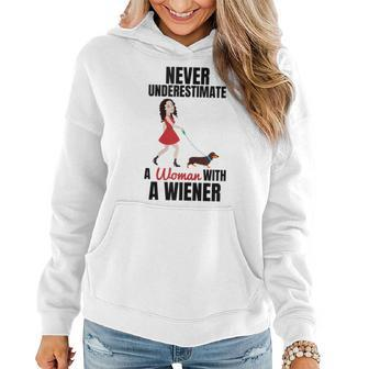 Never Underestimate A Woman With A Wiener Dachshund Women Hoodie - Seseable