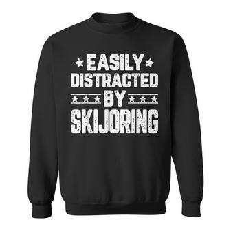 Easily Distracted By Skijoring Skijoring Lover Sweatshirt | Mazezy