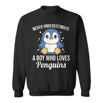 Never Underestimate A Boy Who Loved Penguins Sweatshirt - Seseable