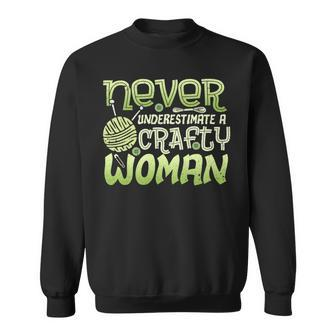 Never Underestimate A Crafty Woman Sweatshirt - Seseable