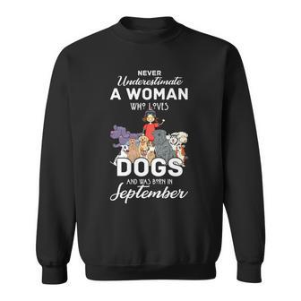 Never Underestimate A Woman Who Loves Dogs Born In September Sweatshirt - Seseable