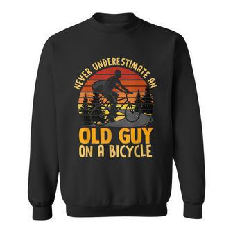 Never Underestimate An Old Guy On A Bicycle Vintage Cycling Sweatshirt - Seseable