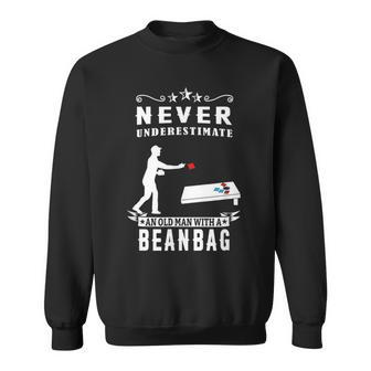 Never Underestimate An Old Man With A Bean Bag Cornhole Old Man Funny Gifts Sweatshirt | Mazezy