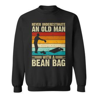 Never Underestimate An Old Man With A Bean Bag Cornhole Sweatshirt - Seseable