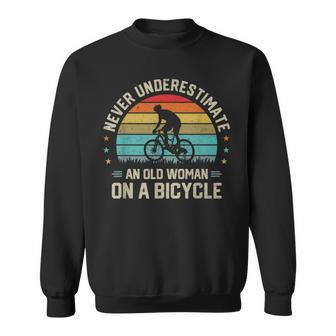 Never Underestimate An Old Woman On A Bicycle Cyclist Rider Old Woman Funny Gifts Sweatshirt | Mazezy