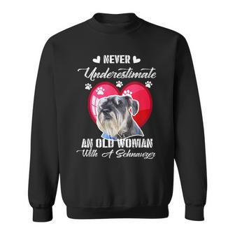 Never Underestimate An Old Woman With A Schnauzer Dog Lover Sweatshirt - Seseable