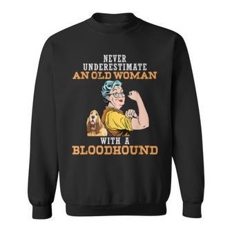 Never Underestimate An Old Woman With Bloodhound Dog Old Woman Funny Gifts Sweatshirt | Mazezy