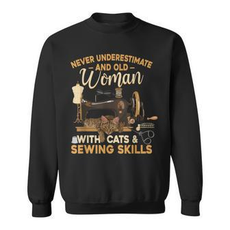 Never Underestimate An Old Woman With Cats And Sewing Skills Sweatshirt - Seseable